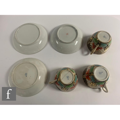 70 - A collection of 19th Century Staffordshire cups and saucers all in variants of the Imari design in a... 