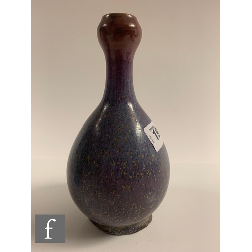 19 - A Chinese Junyao style purple splashed vase, of bottle form rising to a garlic-head rim, height 19cm... 