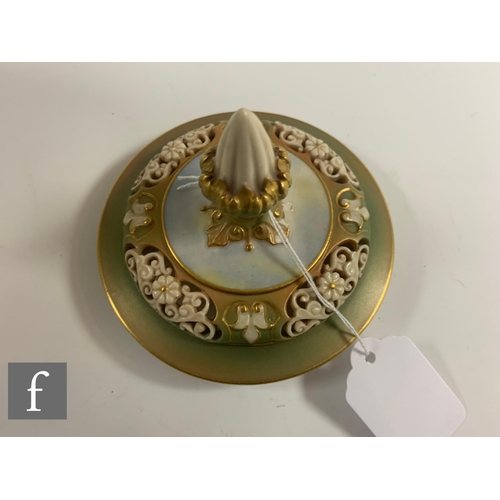 201 - An early 20th Century Royal Worcester Hadley shape pomander and cover, the footed ovoid body with re... 