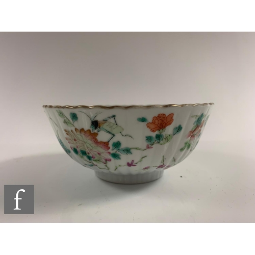 38 - A Chinese Daoguang period (1820-50) famille rose bowl, of fluted form, the white glaze decorated wit... 