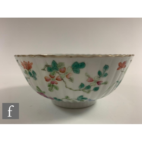 38 - A Chinese Daoguang period (1820-50) famille rose bowl, of fluted form, the white glaze decorated wit... 