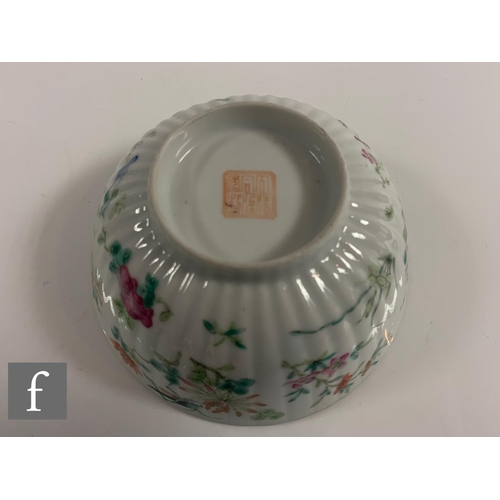 38 - A Chinese Daoguang period (1820-50) famille rose bowl, of fluted form, the white glaze decorated wit... 