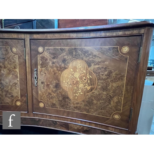 1002 - A 20th Century Italian figured walnut dining room suite, comprising a serpentine front sideboard on ... 