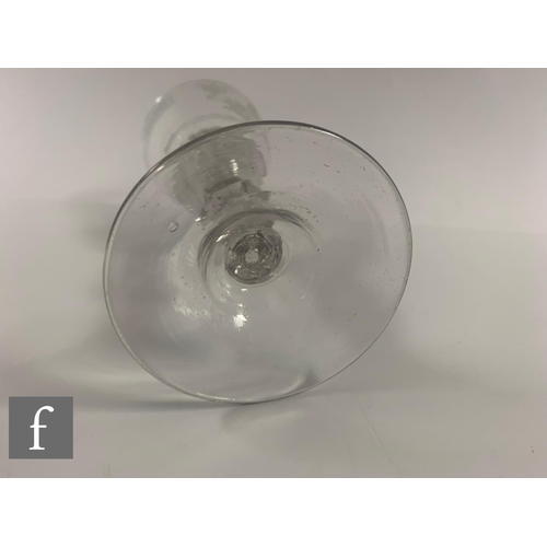 506 - A 19th Century clear crystal drinking glass, the round funnel bowl above a multi knopped facet stem ... 