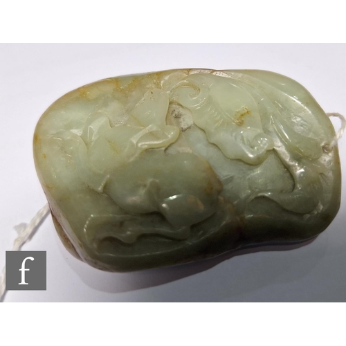 14 - A Chinese Qing Dynasty jade pebble carving, the smooth pale green and russet stone, carved in relief... 