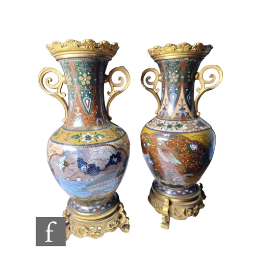 29 - A pair of Chinese cloisonne vases of ovoid form, rising to a flared neck, decorated with ochre, aven... 