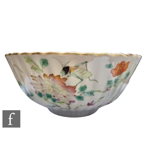 38 - A Chinese Daoguang period (1820-50) famille rose bowl, of fluted form, the white glaze decorated wit... 