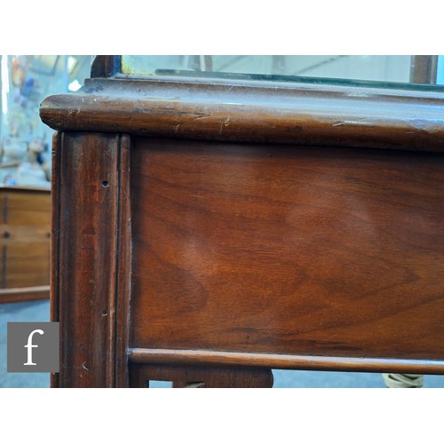 1042 - An Edwardian mahogany floorstanding exhibition style display cabinet, the domed top with four urn sp... 