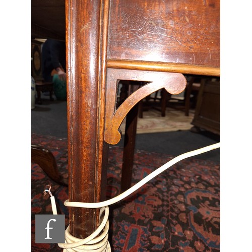 1042 - An Edwardian mahogany floorstanding exhibition style display cabinet, the domed top with four urn sp... 