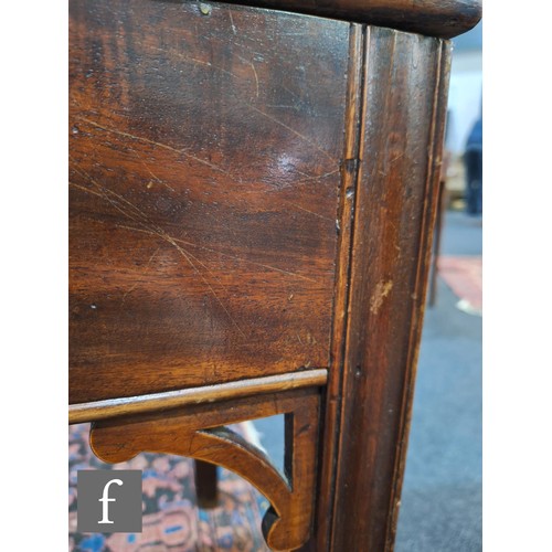 1042 - An Edwardian mahogany floorstanding exhibition style display cabinet, the domed top with four urn sp... 