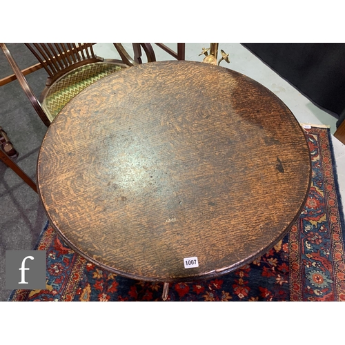 1007 - A George III oak circular tripod occasional table with a bird cage movement and an Art Nouveau coppe... 