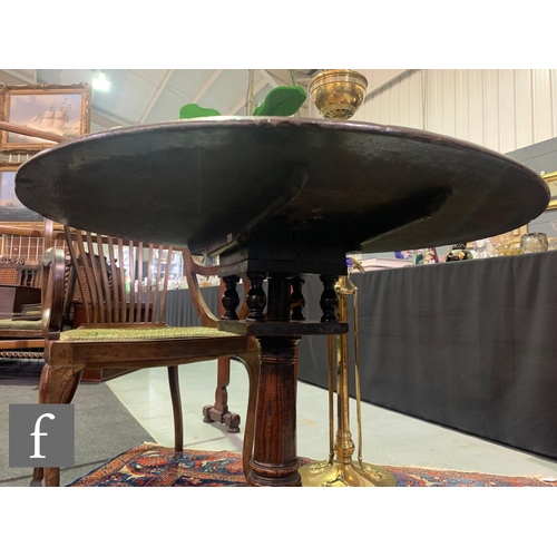 1007 - A George III oak circular tripod occasional table with a bird cage movement and an Art Nouveau coppe... 