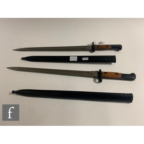 757 - Three German Mauser bayonets and scabbards, a similar Czech bayonet and scabbard with leather holste... 