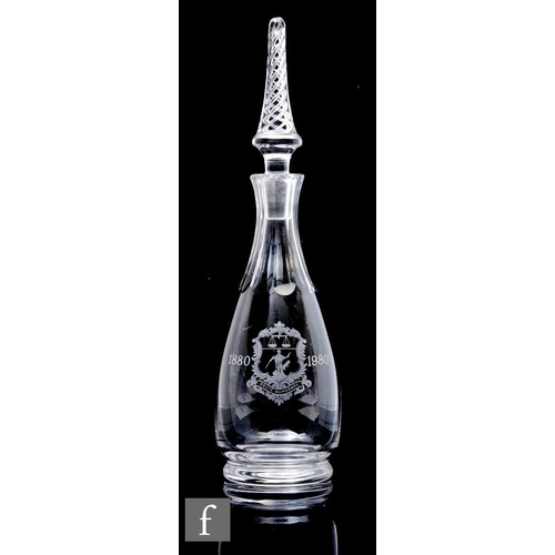 589 - A late 20th Century Stuart & Sons glass decanter of club form, engraved with the coat of arms fo... 