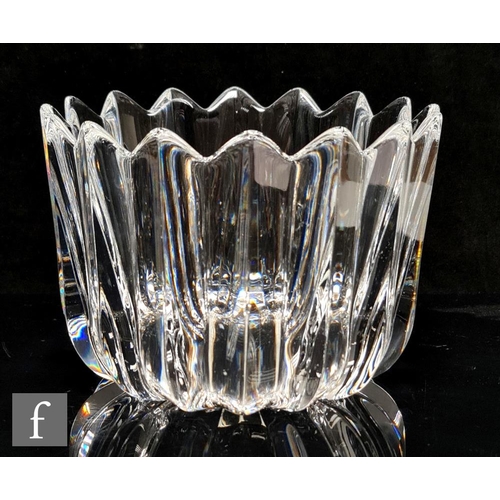 601 - An Orrefors clear glass bowl, of high sided circular form, moulded with vertical triangular panels, ... 