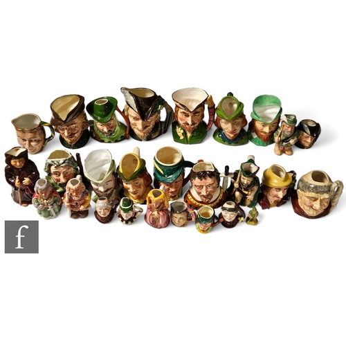 273 - A large collection of 20th Century character and Toby jugs relating to characters from Robin Hood to... 