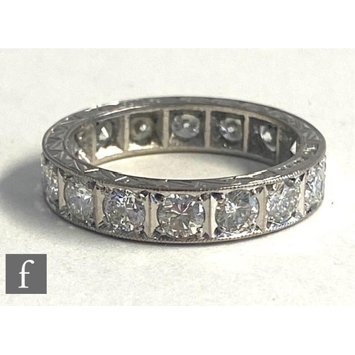 75 - An 18ct hallmarked white gold, diamond full eternity ring comprising sixteen brilliant cut stones, t... 