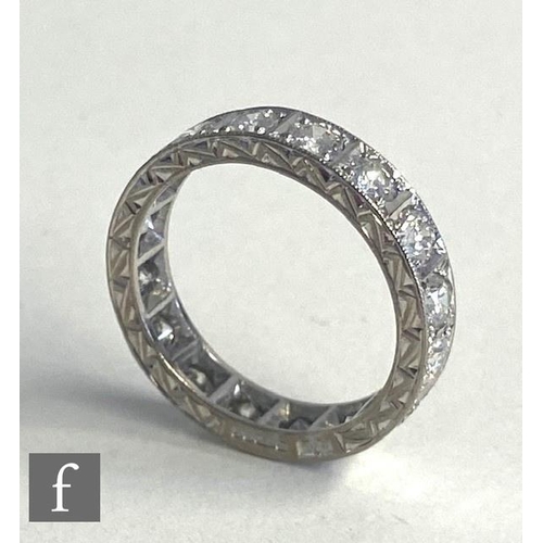 75 - An 18ct hallmarked white gold, diamond full eternity ring comprising sixteen brilliant cut stones, t... 