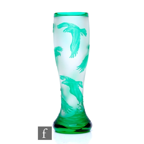 651 - A later 20th Century cameo glass vase of footed swollen sleeve form, cased in green over clear cryst... 