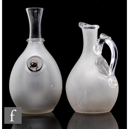 655 - A 19th Century glass jug of ovoid form with an internal ice pocket and applied loop handle, the body... 