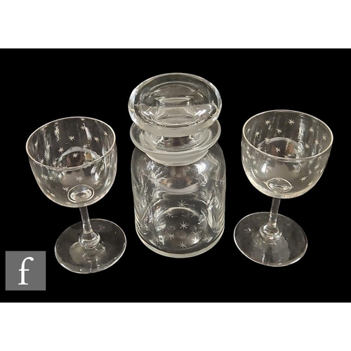 683 - A pair of Whitefriars wine glasses, each with cup bowl finely engraved with stars above a plain stem... 