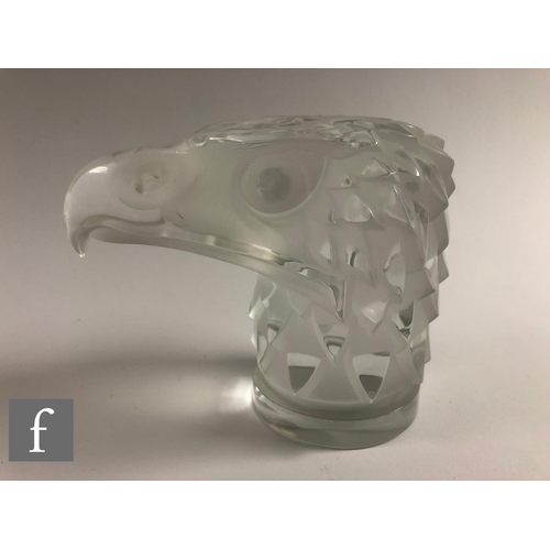 718 - A late 20th Century Rene Lalique car mascot modelled as an eagle's head set to a circular base ... 