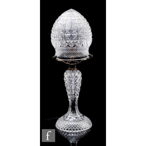 607 - A 1920s clear crystal table lamp, of baluster form with mushroom shade, all with hobnail cut decorat... 