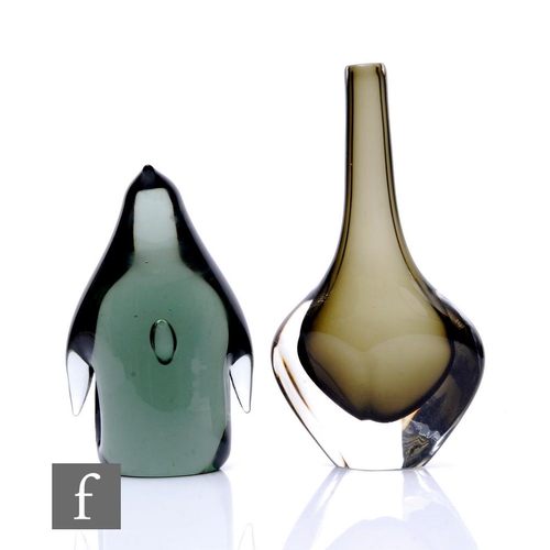 744 - A mid 20th Century Holmegaard glass figure of a stylised penguin with an internal air tear in deep p... 