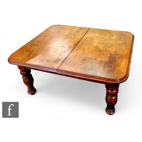 393 - A Victorian extending mahogany dining table, the double edge top over a plain frieze on turned balus... 