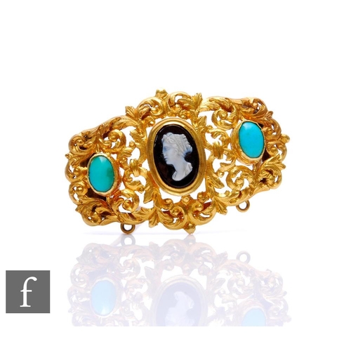 4 - A late 19th to early 20th Century pinchbeck brooch inset with central cameo and two turquoise rounde... 