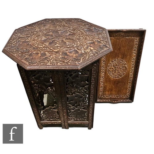 407 - A late Victorian carved hardwood octagonal occasional table, richly decorated with vines and grapes,... 