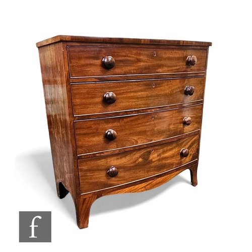 408 - A George III crossbanded mahogany bow front chest of four long graduated drawers, turned wood handle... 