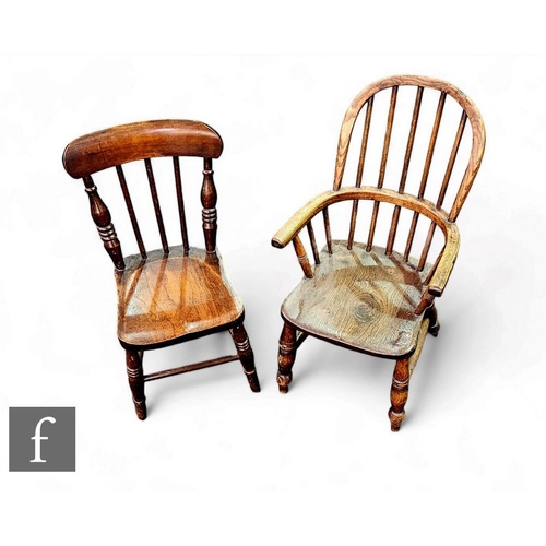 417 - A late 19th to early 20th century Windsor hoop back ash and elm elbow chair and a similar standard c... 