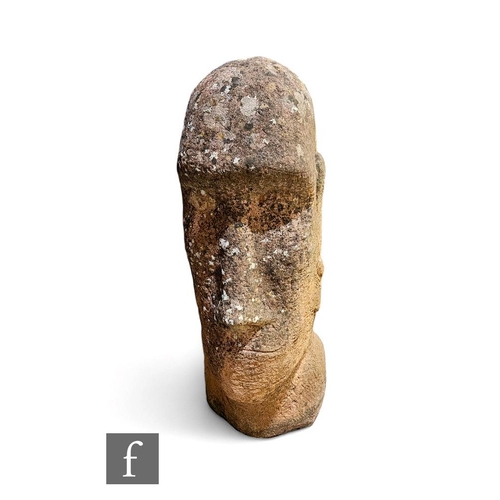 424 - A carved sandstone Easter Island head, height 68cm.