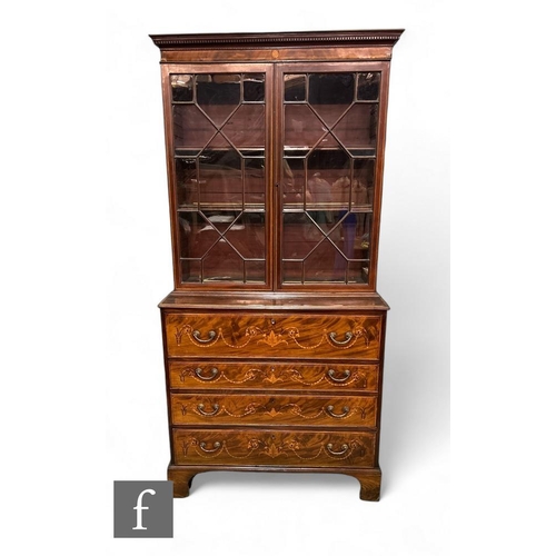 434 - A George III mahogany and inlaid secretaire bookcase, the mahogany and boxwood strung base, inlaid w... 