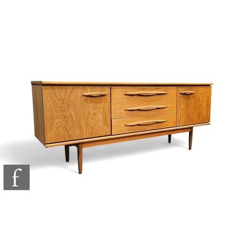 439 - A mid Century Jentique teak sideboard, the plank top above the central three drawers, and flanked by... 