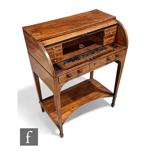 443 - An Edwardian mahogany cylinder bureau de dame, rolling front enclosing fitted interior with pull-out... 