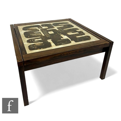 446 - A mid Century Danish rosewood occasional table, the top set with a beige glaze ceramic panel with ab... 