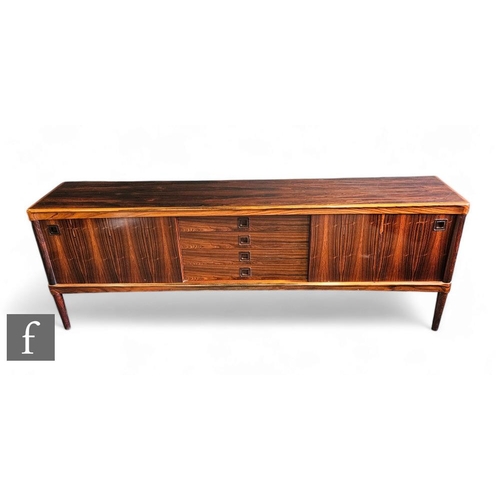 447 - A Danish rosewood veneered sideboard, by W Klein for Bramin Mobler, fitted with a central bank of fo... 