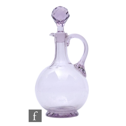 584 - A late Victorian glass decanter of footed globular form with tall collar facet cut neck, with applie... 