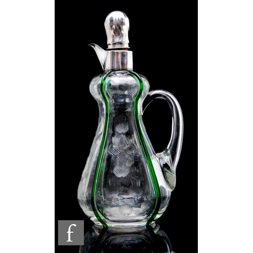 585 - A 20th Century clear crystal glass decanter, of high shouldered and ovoid form, with applied loop ha... 