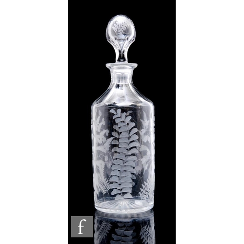 600 - A late 19th to early 20th Century clear crystal decanter, of cylinder form with tapered facet cut ne... 