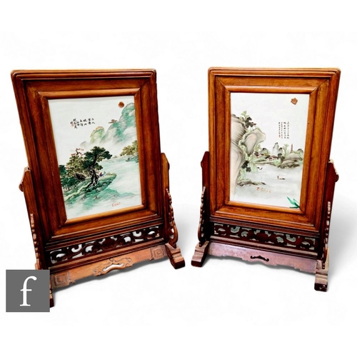 75 - A pair of Chinese late Qing Dynasty/Republic period framed porcelain plaques, each painted in famill... 