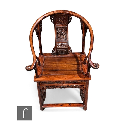 76 - A Chinese officials chair, the tubular frame with plank seat and sweeping arms, carved to the back p... 