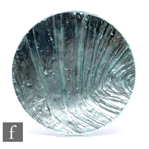 778 - A contemporary studio glass charger by Sue Parry of shallow circular form with an internal blue wave... 