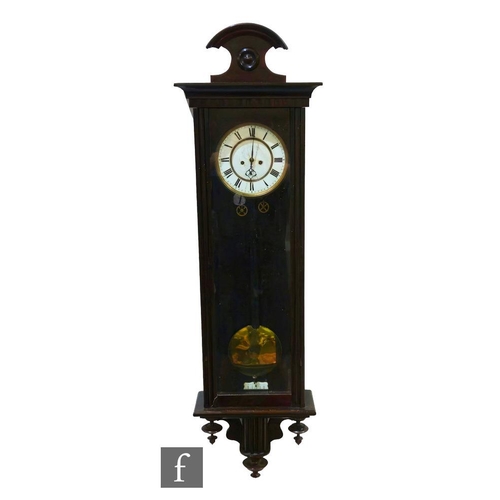 86 - A 20th Century weight driven wall clock, circular enamelled dial enclosed by a glazed door, height 8... 