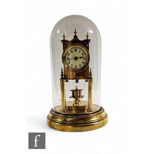 91 - An Edwardian brass 365 day clock by Gustave Becker, the movement stamped, in glass dome case on circ... 