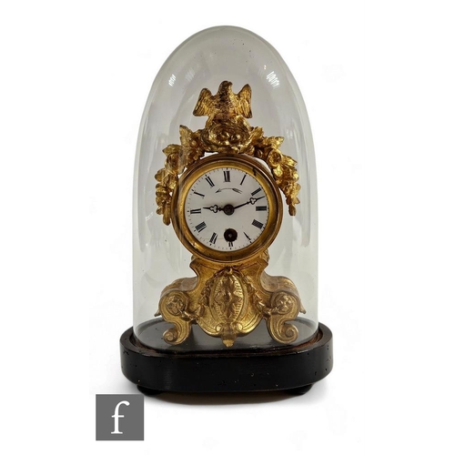 92 - A small 19th Century French gilt metal mantle clock, the dial surmounted with a bird's nest and eggs... 