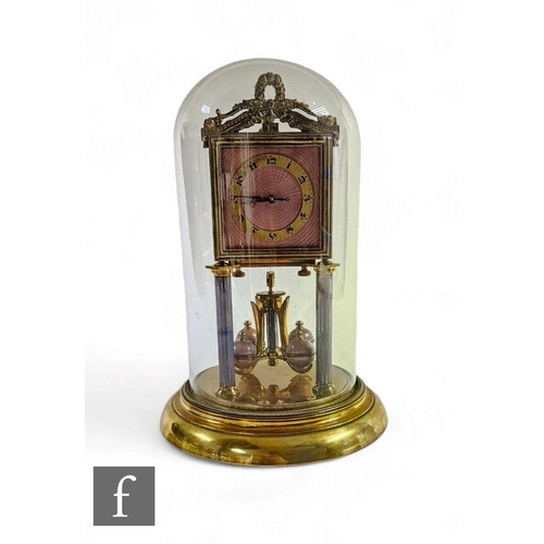 95 - An early 20th Century 365 day mantle clock, the square pink guilloche enamel dial on reeded pillars ... 