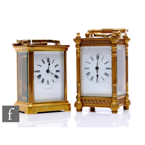 96 - A late 19th Century French brass carriage clock with key, white enamelled dial, pierced fret pillar ... 